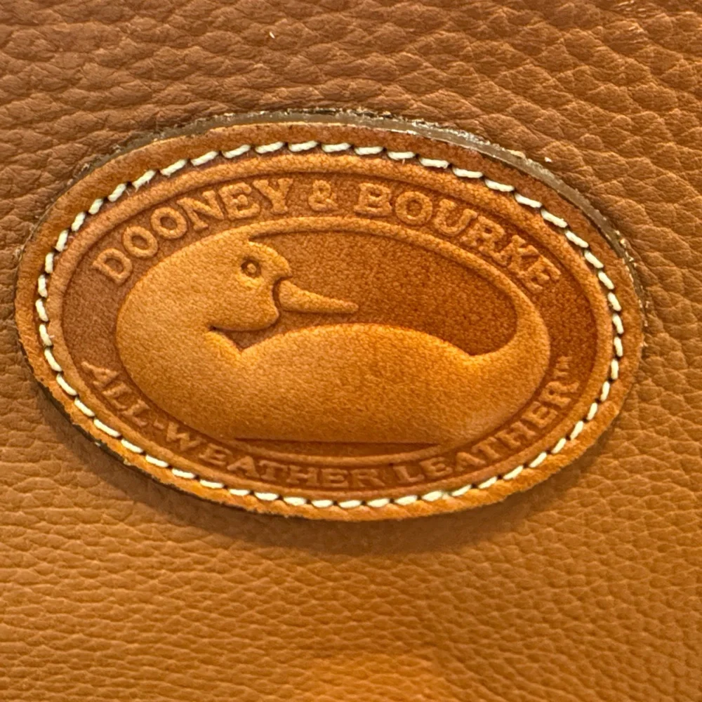 Vintage camel colored Dooney and Bourke all weather leather briefcase/laptop bag